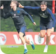  ??  ?? Harry Maguire in training with Adam Lallana