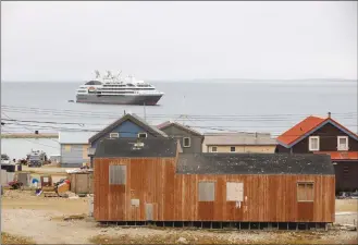  ?? Canadian Press photo ?? A cruise ship sits off the shore of the town of Gjoa Haven, Nunavut on Sept. 3.