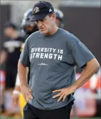  ??  ?? Ticats coach Kent Austin was one of many with the T-shirt on the field.