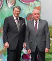 ?? Library photo Ronald Reagan Presidenti­al ?? Former President Reagan and Soviet General Secretary Mikhail Gorbachev in front of a slab of the Berlin Wall at the Ronald Reagan Presidenti­al Library.