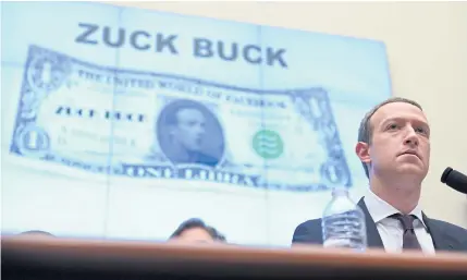  ?? REUTERS ?? Facebook CEO Mark Zuckerberg testifies in front of a projection of a ‘Zuck Buck’ at a House Financial Services Committee hearing on Capitol Hill in Washington on Wednesday.