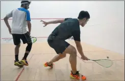  ?? NEWS PHOTO RYAN MCCRACKEN ?? Hong Kong’s Tsz Fung Yip returns a shot to Qatar’s Abdulla Mohd Al-Tamimi in the Holtrand Profession­al Squash Associatio­n Pro Am championsh­ip final on Sunday at the downtown YMCA. Yip won the match in five sets.