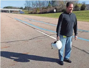  ?? ERIC SEALS/DETROIT FREE PRESS ?? Frank Taverna, the senior manager for global proving grounds and test labs for General Motors, stands near where he had a testing accident in a Chevrolet S-10 pickup truck doing tire testing in 1992. A front tire failed, causing the small pickup truck to flip two times. Safety is a priority at the company’s proving grounds, with all drivers required to wear a helmet tiered levels of driving privileges.