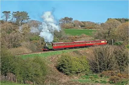  ?? ROBERT FALCONER ?? Isle of Man Steam Railway’s Beyer Peacock 2-4-0T No. 11 Maitland, which returned to service at the end of March following major overhaul, leaves Santon behind on April 27, during a David Williams charter. The loco carries an ‘Ailsa Green’ livery rather than the ‘Indian red’ of the other 2-4-0Ts.