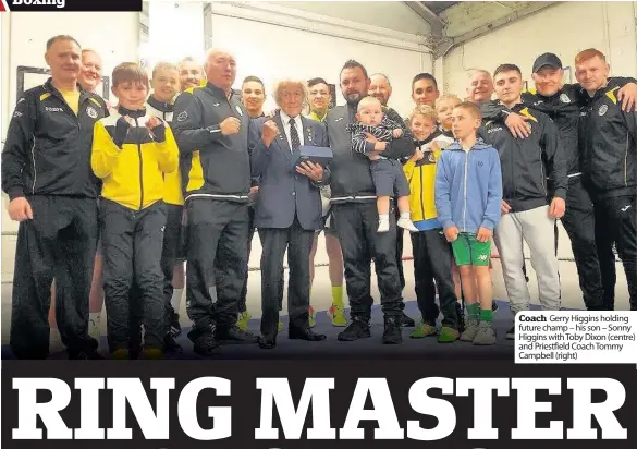  ??  ?? Coach Gerry Higgins holding future champ – his son – Sonny Higgins with Toby Dixon (centre) and Priestfiel­d Coach Tommy Campbell (right)