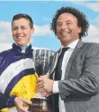  ??  ?? Damian Lane and trainer Simon Zahra with the Oaks trophy.