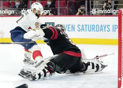  ?? GERRY BROOME AP ?? Panthers defenseman Radko Gudas has a scoring chance but Carolina goaltender Alex Nedeljkovi­c does the splits to kick it away. Nedeljkovi­c stopped 20 shots to record the shutout for the Hurricanes.
The Panthers are 1 of 20 on the power play since Aaron Ekblad’s injury and dropped a second straight game at Carolina, but they’re clearing cap space for a trade.