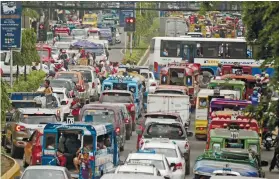  ?? SUNSTAR FILE ?? HOLIDAY TRAFFIC. The holiday season is expected to worsen traffic congestion in major streets in Cebu, like this one in downtown Cebu City. /
