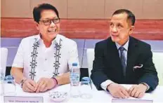  ?? Abdul Rahman/Gulf News ?? Constancio R. Vigno Jr (right) with Silvestre Bello III explaining ■ the recruitmen­t agreement signed with the UAE to Filipino community members in Abu Dhabi on Wednesday.