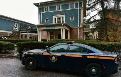  ?? DAVID BAUDER/ASSOCIATED PRESS ?? A New York State Police Department cruiser was parked in front of Cornell University’s Center for Jewish Living in Ithaca, N.Y. on Monday.