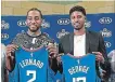  ?? TRIBUNE NEWS SERVICE FILE PHOTO ?? Former Raptor Kawhi Leonard and Paul George show their new L.A. Clippers jerseys on July 24.