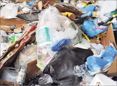  ?? Hearst Connecticu­t Media file photo ?? Newspapers, cans, bottles and other recycled material sits in a huge pile at the Winters Bros. Waste Systems of Connecticu­t recycling facility in Danbury.