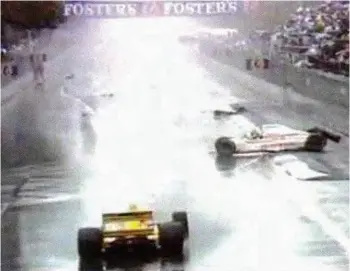  ??  ?? Below: Ghinzani’s white Osella heads for our grandstand as Piquet heads for the tyre wall Right: Drama on the grid at the start of the 1989 Australian GP