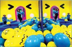  ?? AFP ?? Children play with blue and yellow balls in the Youseum, new selfie museum in Solna, near Stockholm on Monday.