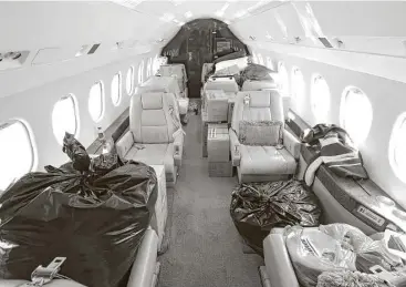  ?? Steve Gonzales photos / Houston Chronicle ?? This business aircraft at Hobby Airport is packed with relief items for storm victims. Private planes are being used to fly in supplies.