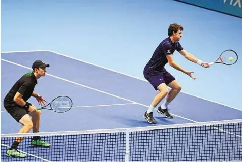  ?? Reuters ?? Net gains Great Britain’s Jamie Murray and Australia’s John Peers during their match at the Barclays ATP World Tour Finals — O2 Arena, London. The world’s the top eight singles players and pairs are competing in a bid to end the season on a high.