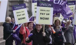  ??  ?? Thousands of workers have received settlement­s in equal pay disputes