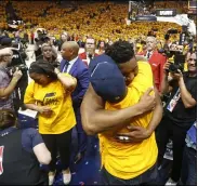  ?? RICK BOWMER — THE ASSOCIATED PRESS ?? Jazz guard Donovan Mitchell, center, hugs his father as he walks off the court April 27, 2018, following Game 6of a first-round playoff series in Salt Lake City.