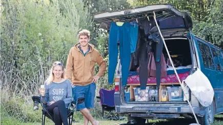  ?? Photo: ALDEN WILLIAMS/FAIRFAX NZ ?? French tourists Julie Etcheverry, left, and Tristan Tranchard in Golden Bay featured in Charles Anderson’s report on freedom campers.