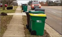  ?? NICK BLIZZARD / STAFF ?? New exterior property maintenanc­e rules in Miami Township that include fines are aimed at chronic violators. The rules address how long and when trash containers can be at a curb.