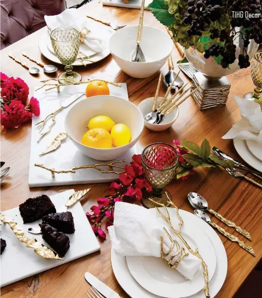  ??  ?? Adva Cutlery Set in Gold, `10,080 for a set of 24, Acacia Cheese Board Set in Snow Leopard, `5,700 for set of 2, Azella Serving Set, `3,800 for set of 2; Azella Cutlery Set in Gold, `10,080 for set of 24, Adva Cheese Board in Snow Leopard, `4,200 for set of 2, Acacia Napkin Weight, `1,500, Acacia Napkin Ring Set, `4,500 for set of 6, all from XAKA Cutlery