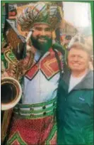  ?? PEG DEGRASSA — DIGITAL FIRST MEDIA ?? This photograph shows costumer James May, right, with Eagles player Jason Kelce, wearing the Mummers hat that May designed and hand made eleven years previous.