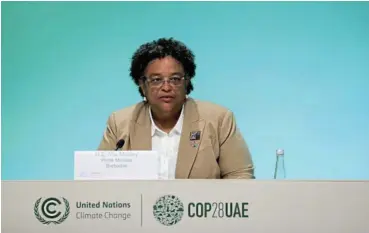  ?? /Reuters ?? Prominent voice: Barbados Prime Minister Mia Mottley attending a press conference at the COP28 World Climate Summit, in Dubai, United Arab Emirates. She urged countries to consider taxes as a way to boost climate funding.