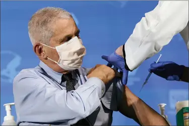  ?? ASSOCIATED PRESS FILE PHOTO ?? Dr. Anthony Fauci, director of the National Institute of Allergy and Infectious Diseases, prepares to receive his first dose of the COVID-19 vaccine at the National Institutes of Health in Bethesda, Md.