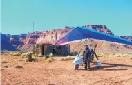  ??  ?? Since he started flying ultralight­s in 2004, Jeff Gilkey has explored much of New Mexico from the air and flown over neighborin­g states as well. In this picture, taken about 2009, Gilkey stands by his ultralight trike on Bureau of Land Management land...