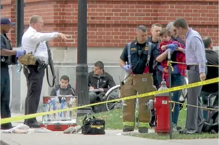  ?? PHOTO: REUTERS ?? A girl is led to an ambulance by emergency personnel following the attack at Ohio State University’s campus in Columbus.