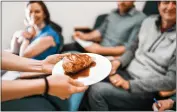  ?? ?? A student presents a plant-based alternativ­e meat prototype designed to resemble a chicken drumstick with skin and bone during a previous Alternativ­e Meats X-Lab course at UC Berkeley's College of Engineerin­g.