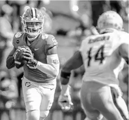  ?? JOSH MORGAN/AP ?? Clemson QB D.J. Uiagalelei (5) passes the ball against Boston College during the 2020 season. He is poised to take over leading the Tigers’ revamped offense.