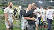  ??  ?? Approval rating: Eddie Jones hugs Billy Vunipola in the aftermath of a memorable victory