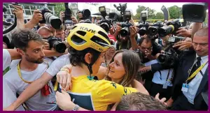  ?? EPA ?? Paris love match: the Tour king embraces wife Sara