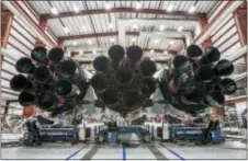  ?? SPACEX VIA AP ?? This photo made available by SpaceX on Wednesday shows the new Falcon Heavy rocket in a hangar at Cape Canaveral, Fla. It is scheduled for a test flight in January.