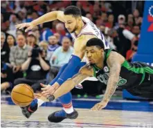  ?? AP PHOTO BY MATT SLOCUM ?? The Boston Celtics’ Marcus Smart, right, and the Philadelph­ia 76ers’ Ben Simmons chase after a loose ball during their NBA second-round playoff series game Monday in Philadelph­ia.