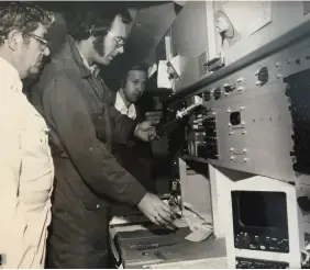  ??  ?? ABOVE / RNZAF specialist engineers Keith Garland, left, and Dennis Street with Garry, at rear, onboard an RNZAF Fokker F27 surveillan­ce aircraft equipped with radar and surveillan­ce equipment fitted out by the National Airways Corporatio­n.