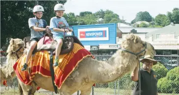  ??  ?? Matthew and Adam Parker were quick to mount up for a camel ride at last year’s Festival; File photograph­s.