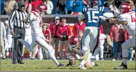  ?? NWA Democrat-Gazette/BEN GOFF ?? The Razorbacks’ Connor Limpert kicks the game-winning 34-yard field goal with four seconds left in the game.