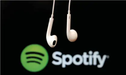  ?? Photograph: Christian Hartmann/Reuters ?? Streaming services such as Spotify account for more than 80% of all music listened to in the UK.