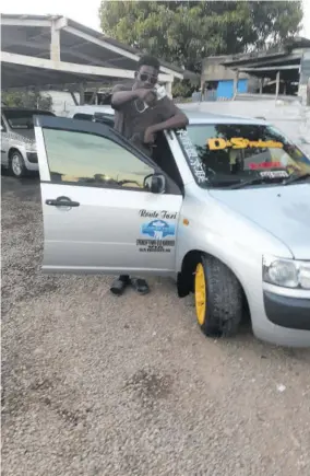  ??  ?? Taxi man ‘Chappo’, who operates on the Old Harbour to Spanish Town route, gives his approval to Tina’s Car Wash.