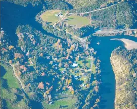  ?? Photo / Paul Brooks ?? The roadmap suggests it will be a while before tourists return in numbers. Hiruharama on the Whanganui River, left, is a popular tourist destinatio­n.