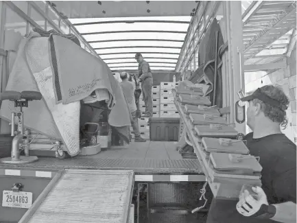  ??  ?? June 28, 2018 - The Orpheum's Wurlitzer pipe organ rests safely covered as workers continue to load the rest of the dismantled organ for transport. The iconic organ will travel to Chicago where it will spend the next 18 months undergoing a complete...