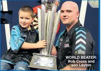  ??  ?? WORLD BEATER: Rob Cross and son Leyton