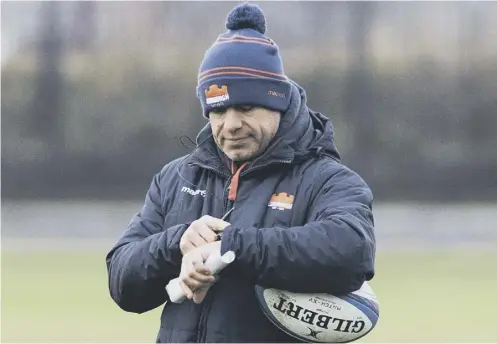  ??  ?? 0 Edinburgh head coach Richard Cockerill checks his watch during a training session ahead of the European game against Newcastle.