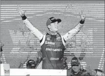  ?? Rick Scuteri Associated Press ?? CHRISTOPHE­R BELL celebrates his Xfinity victory outside of Phoenix. It was his seventh victory of the season.