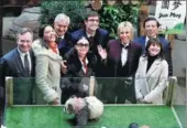  ?? BENOIT TESSIER / REUTERS ?? Zhang Yesui, vice-foreign minister (right) and French first lady Brigitte Macron (third from right), wife of French President Emmanuel Macron, pose with other officials at the naming ceremony for a panda cub in France on Monday.