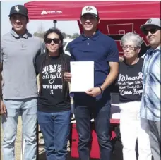  ??  ?? Imperial High graduate Kobby Lopez (center) smiles for a photo along with his brother, sister, grandmothe­r and father after signing his letter of intent on Sunday morning in Calexico. KARINA LOPEZ PHOTO