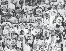  ?? JASON HALSTEAD/GETTY IMAGES ?? The Jets’ playoff run has put Winnipeg and its white-clad fans in the national spotlight.