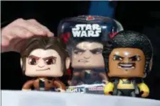  ?? RICHARD DREW — THE ASSOCIATED PRESS FILE ?? In this file photo, the Star Wars Hans Solo Mighty Muggs, by Hasbro, are demonstrat­ed at the TTPM 2018 Spring Showcase, in New York. Hasbro Inc. (HAS) on Monday, Oct. 22, reported third-quarter earnings of $263.9 million.